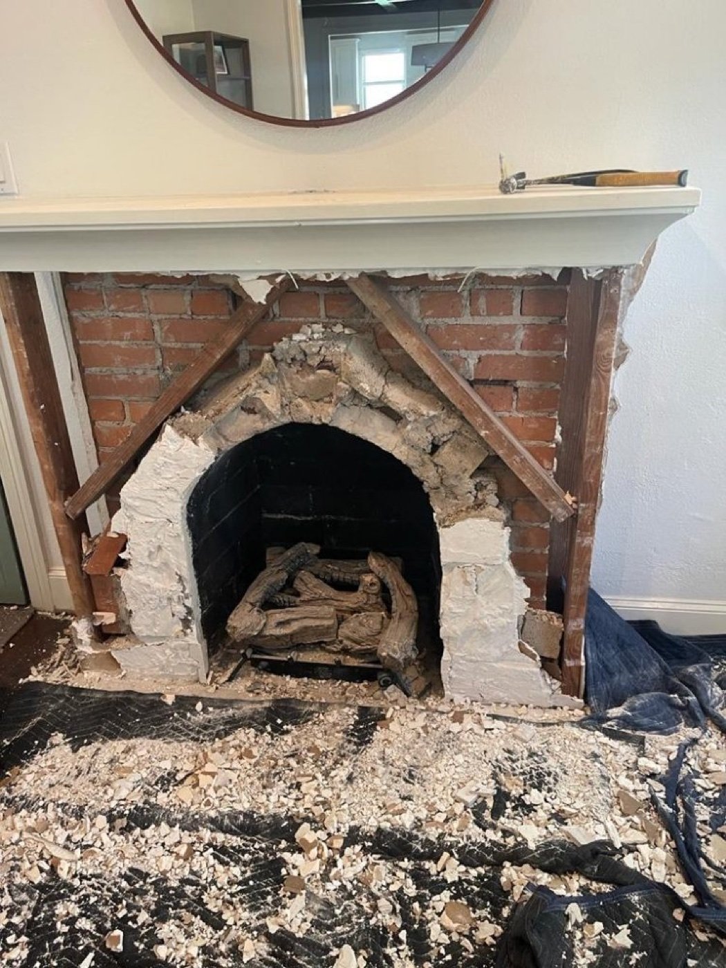 Fireplace surround before repair Dallas TX — deteriorated brick and mortar needing full replacement